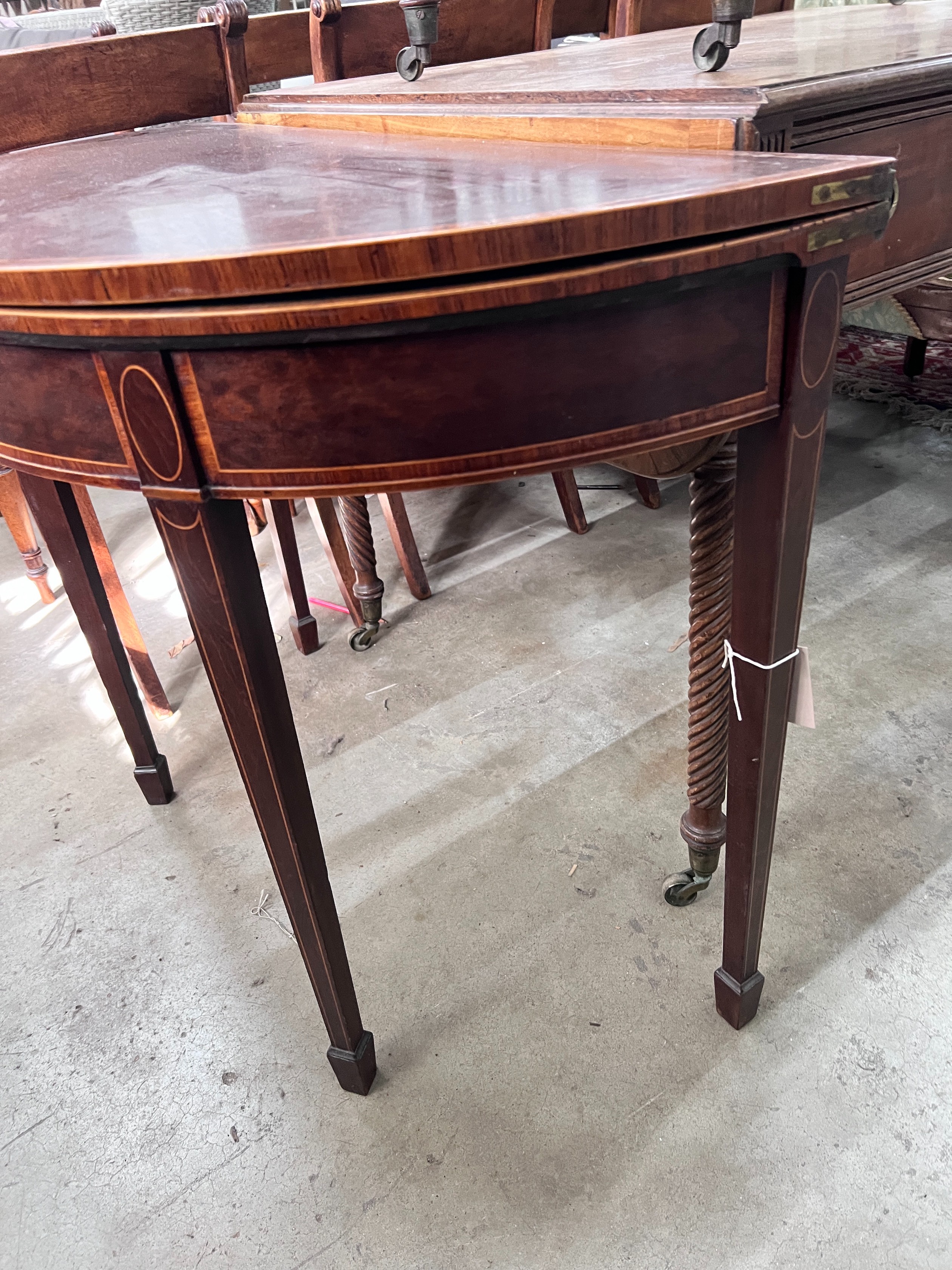 A George III banded mahogany D shape folding card table, width 92cm, depth 45cm, height 73cm *Please note the sale commences at 9am.